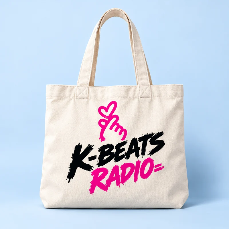 Natural canvas tote with black and pink K-Beats Radio lettering and a finger-heart.